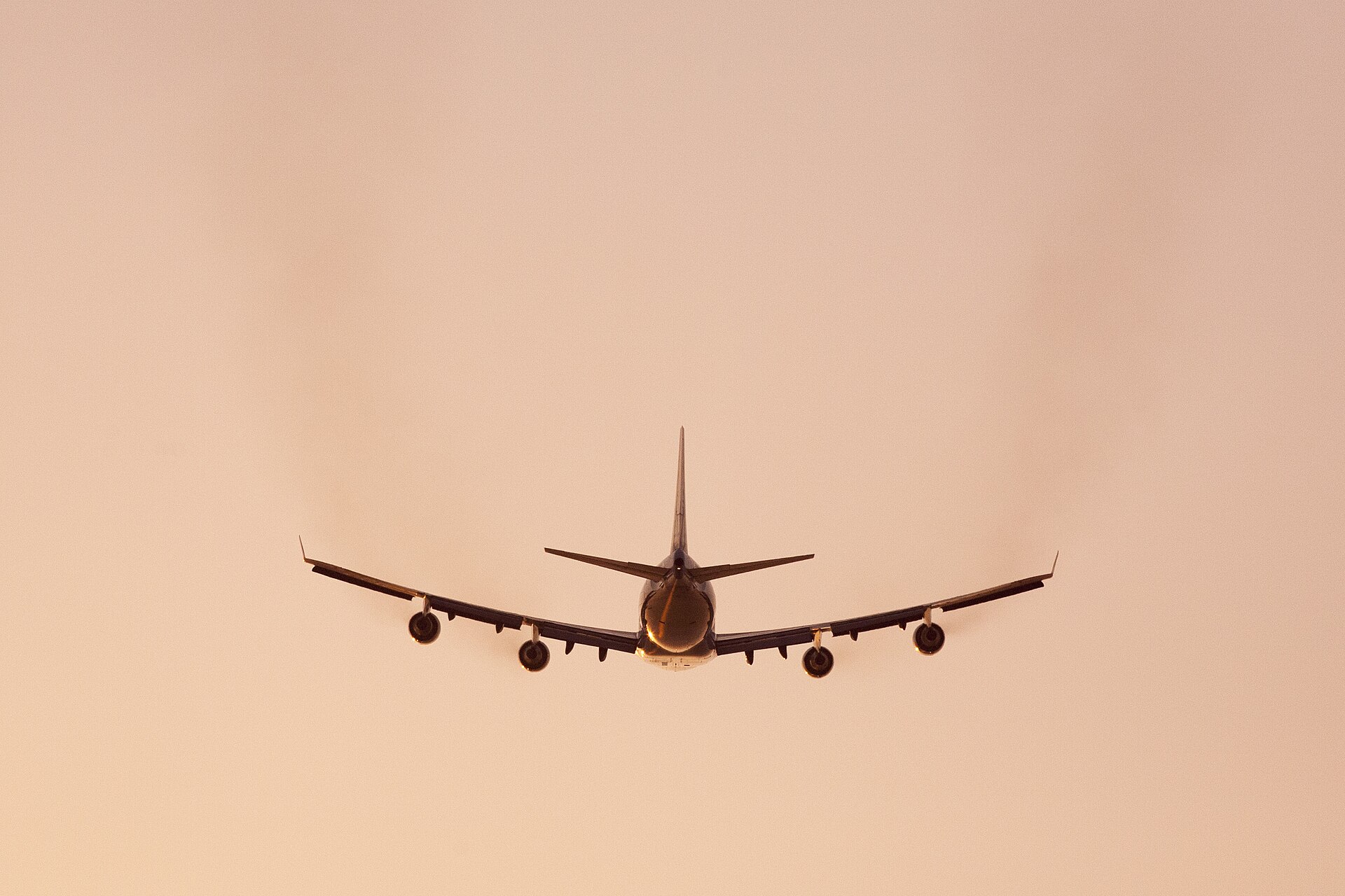 Boeing 747 climbing away after takeoff in golden evening light